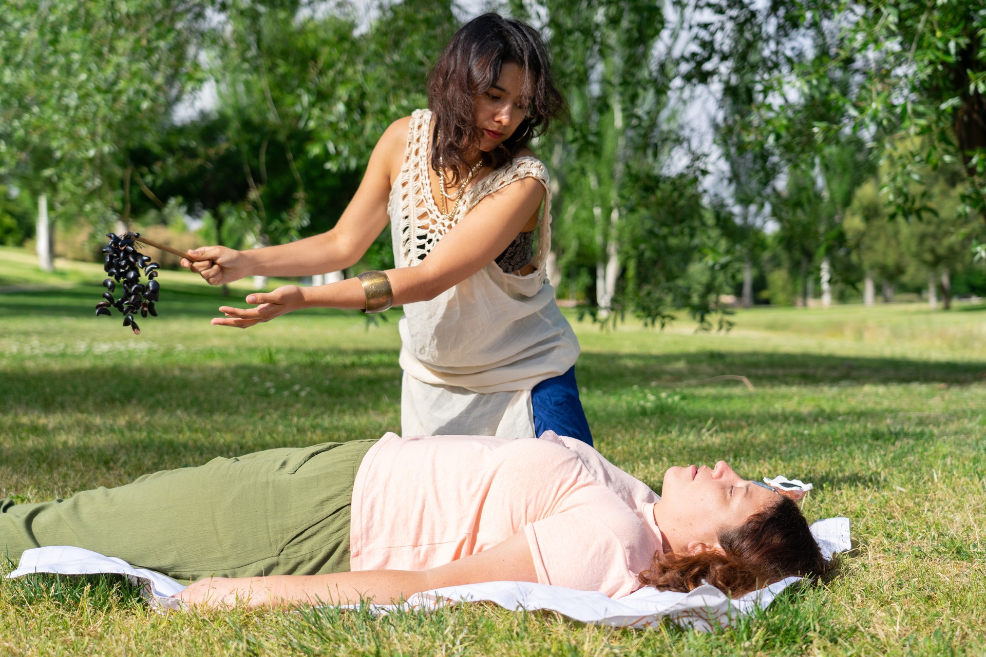 Outdoor breathwork therapy. Latin woman therapist